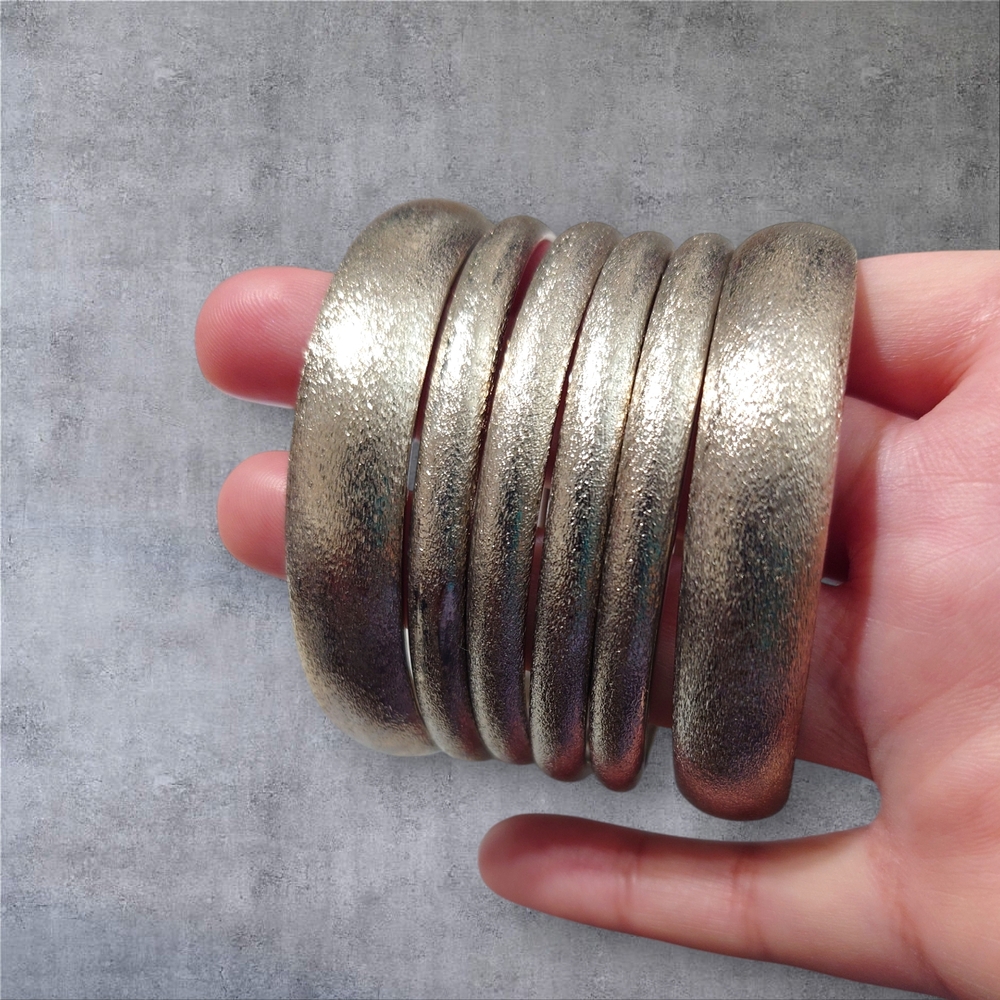 A Set Of Elegant Silver Slightly Textured Bangles Set